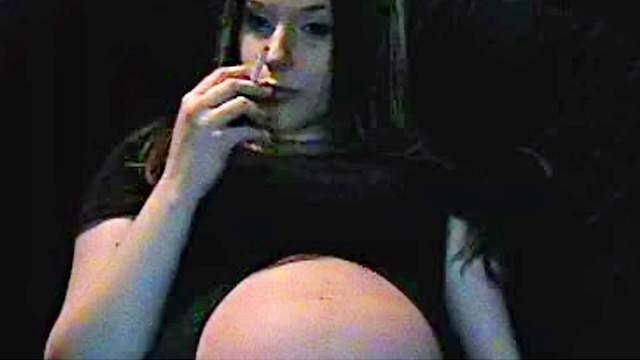 Pregnant slut is smoking in the room