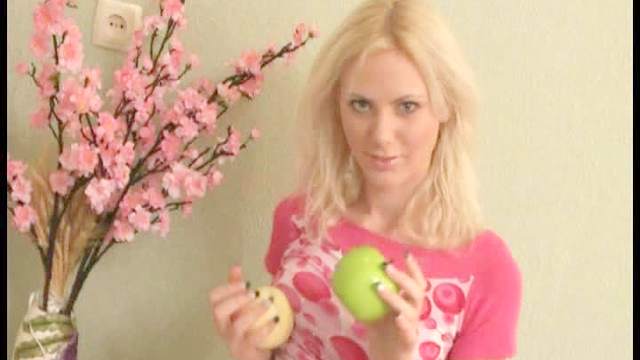 Beautiful blonde Tina playing with her pink flower