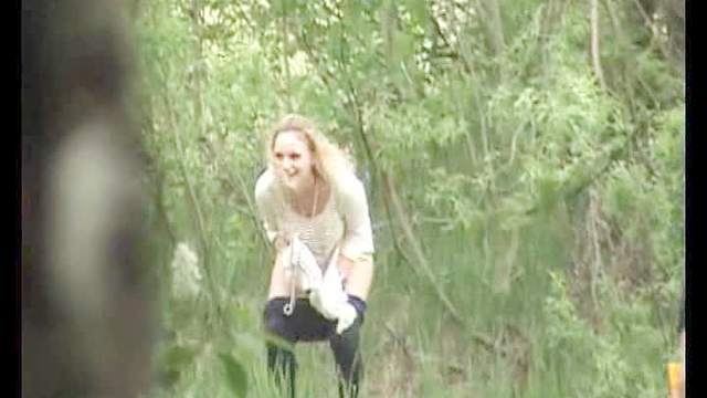 Pretty girl pissing in the woods