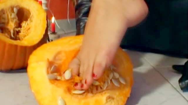 Eve Angel crushes pumpkin with feet