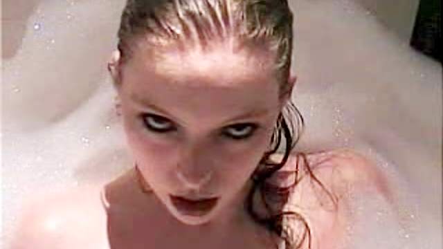 Seductive teen chick masturbates in her bathtub