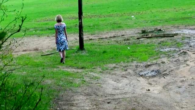 Sweet young girl goes pee outdoors