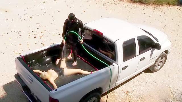 Rubber girl water play in the truck bed