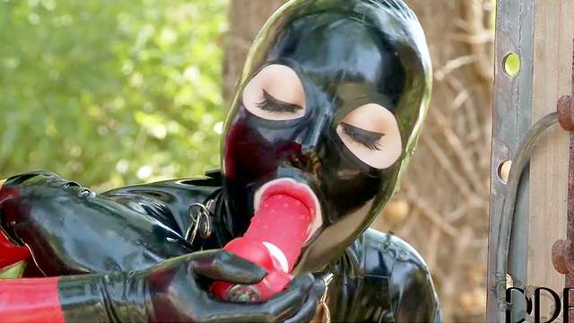 Kinky latex fetish play outdoors