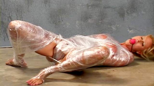 Plastic wrapped girl masturbates pussy