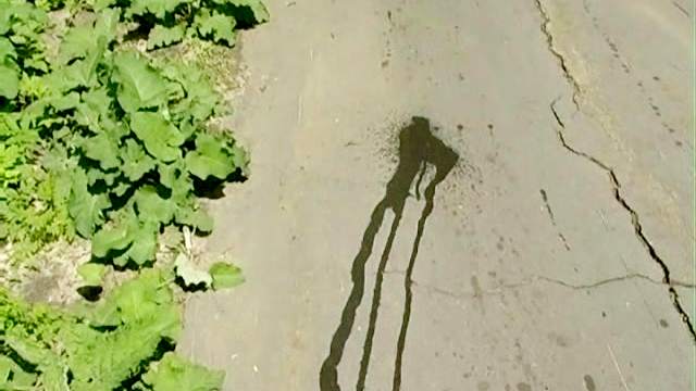 Redhead takes a big piss on the road