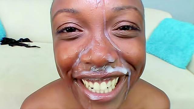 Shaved head black girl sucks to facial