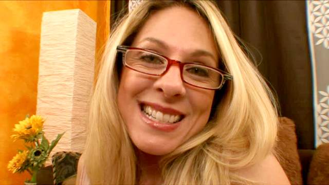 Classy milf in glasses sucks off a dick