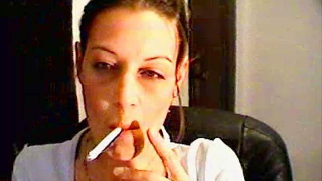 She smokes close up on webcam