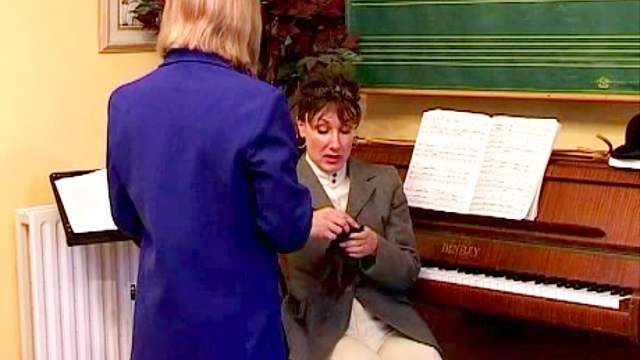 Piano teacher spanks her student hard