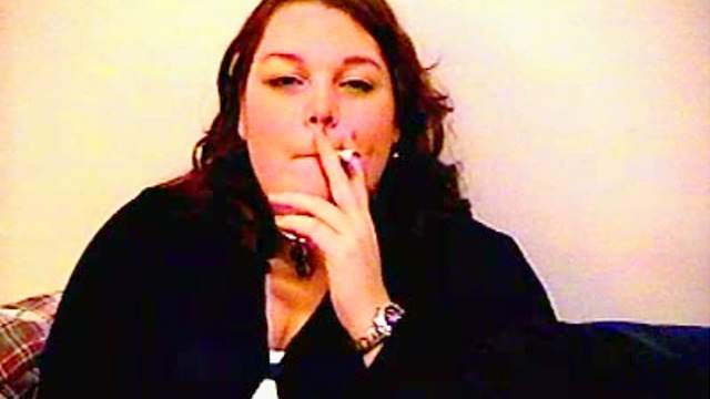 Fat amateur girl smokes cigarette