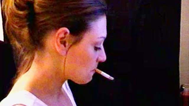 Cute babes smokes a cigar and poses on camera