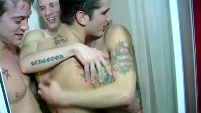 Four sexy guys in a cramped shower