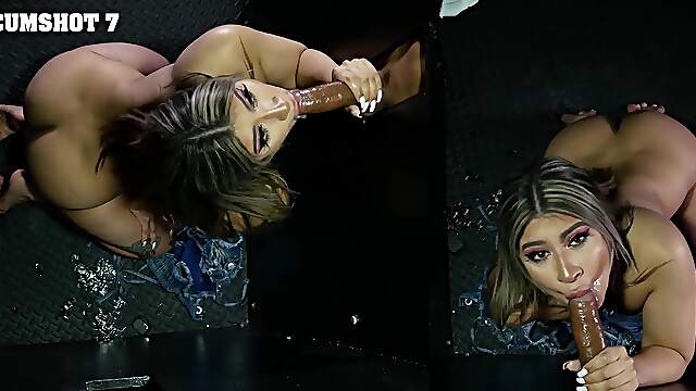 Petite cutie Mila Milkshake sucks a big black cock through a gloryhole.