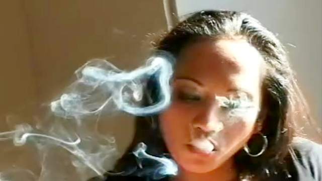 Ebony chick smokes and masturbates on camera