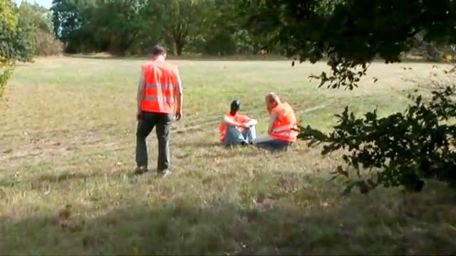 Mistresses humiliate slave men outdoors