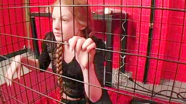 Teen redhead in pigtails caged by mistress