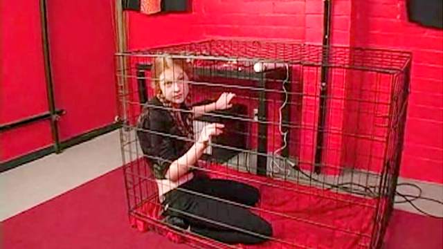 Teen redhead in pigtails caged by mistress