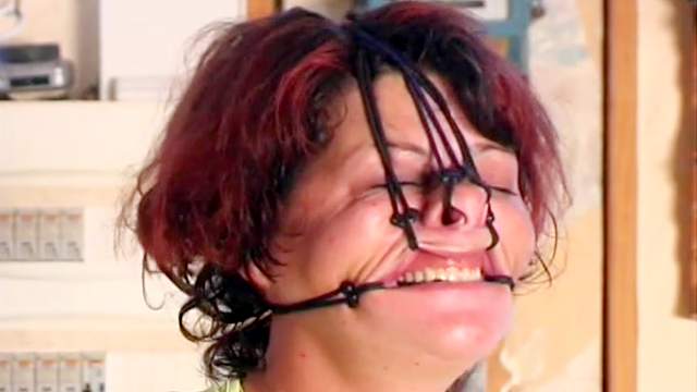 Hot wax drips over a bound body