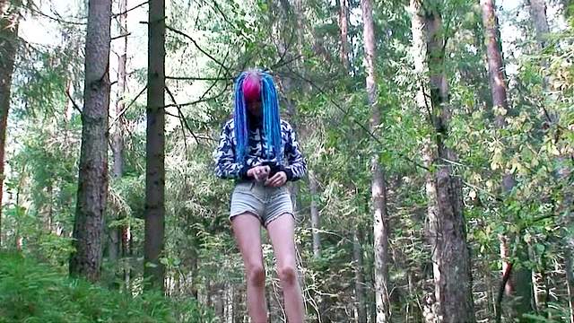 Blue haired cutie pissing outdoors