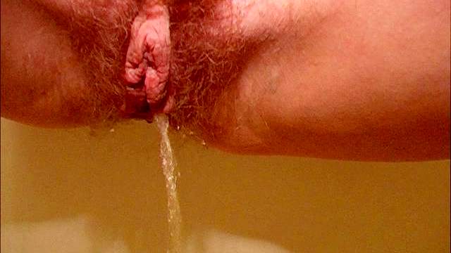 Skinny Russian redhead pissing in shower