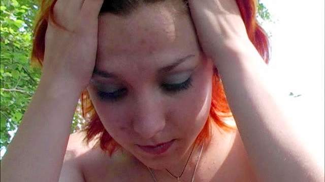 Redhead pees outdoors in the nude