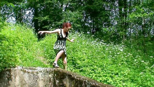 Redhead in red panties pisses outdoors
