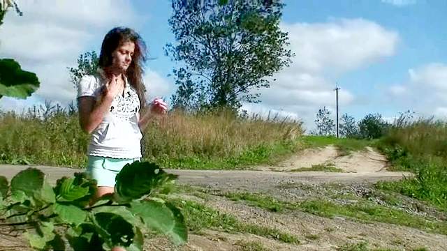 Short shorts girl pissing in the dirt