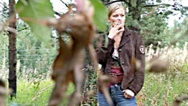 Cute blonde goes pee in the woods