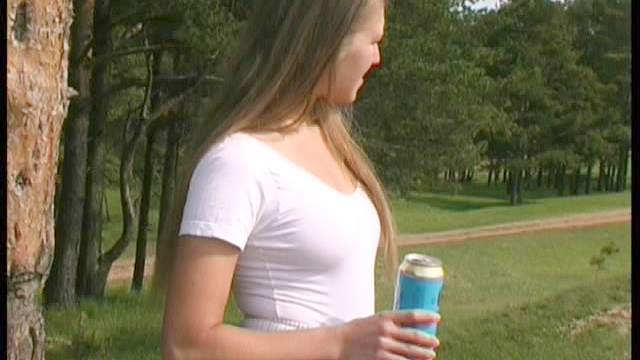 Girl with big clit pisses outdoors in close up