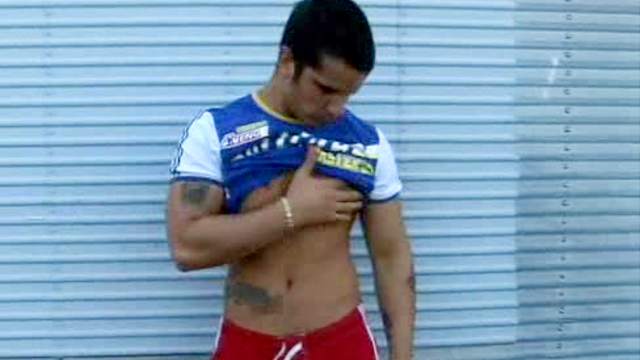 Muscular solo guy strokes dick outdoors
