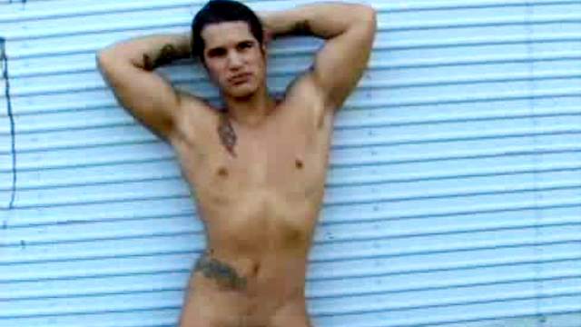 Muscular solo guy strokes dick outdoors