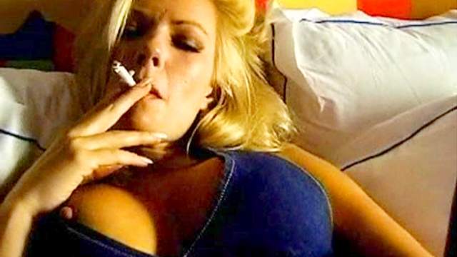 Smoker in pantyhose lustily rubs her pussy