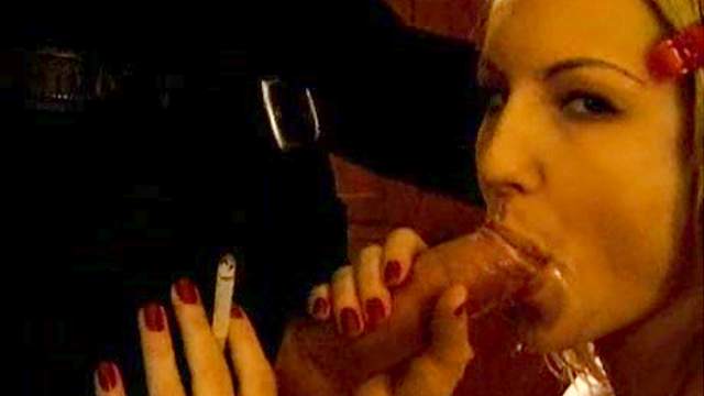 Sensual cocksucking with cigarette in hand