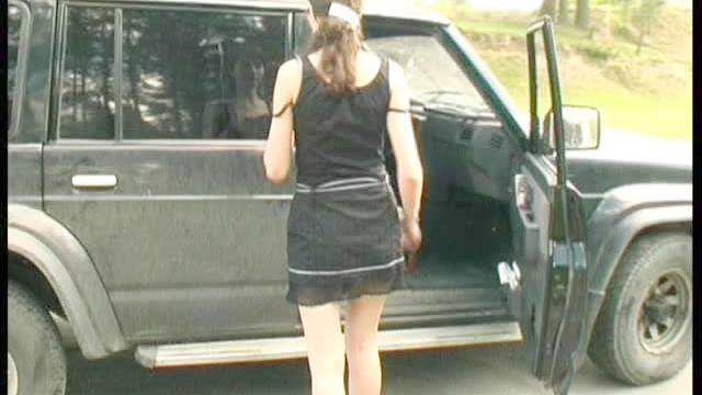 Smoking chick pissing outside her car