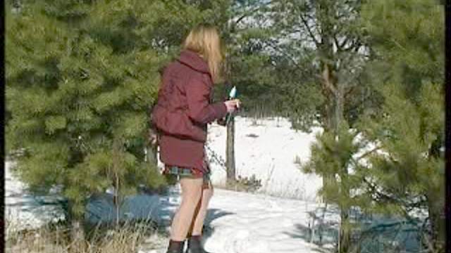 Skirt girl pissing in the snow