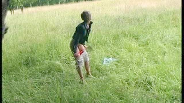 Pussy of a teen pees in a field
