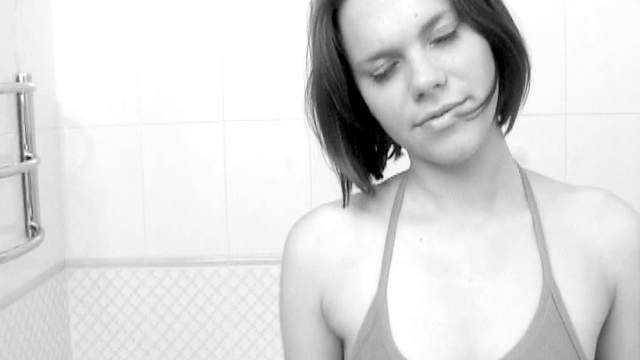 Black and white of teen taking a shower