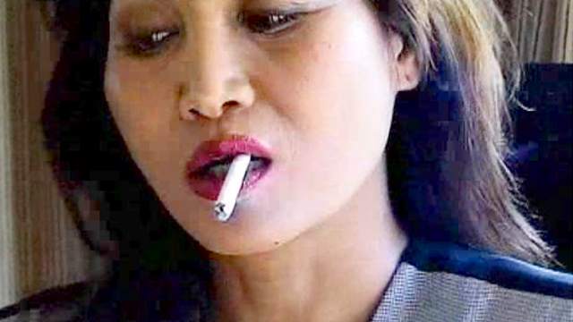 Asian smokes and makes it erotic