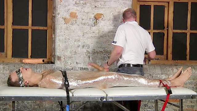 Handjob for bound boy in plastic wrap