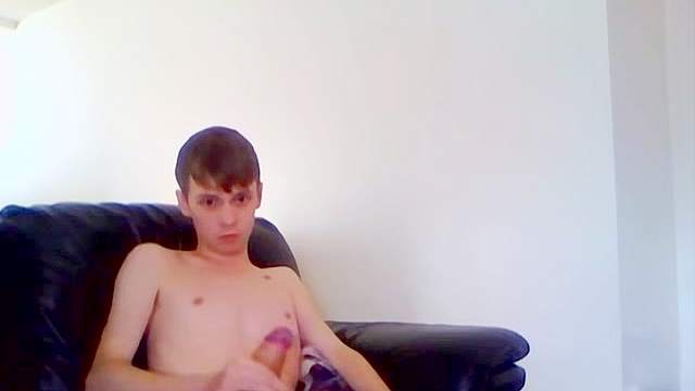 Wide eyed solo teen boy jerks off