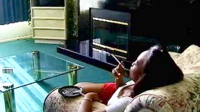 Black girl smokes cigarette solo