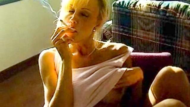 Blonde smokes and shows us her big tits