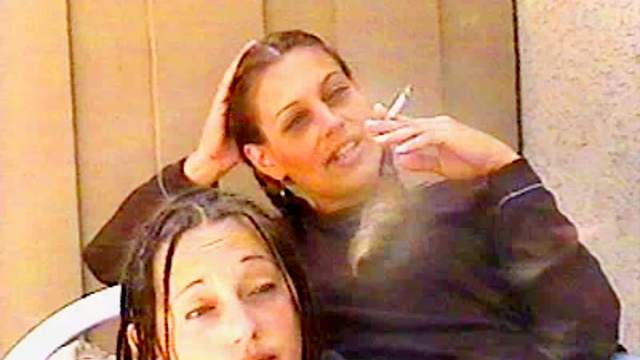 Two sexy chicks smoke together