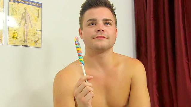 Cute boy sucks lollipop and talks