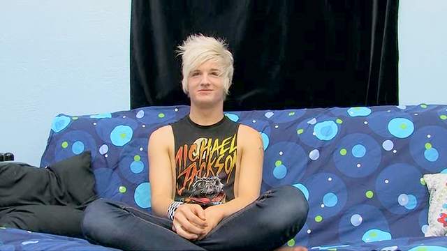 Blonde hair twink boy with tattoo jerks off