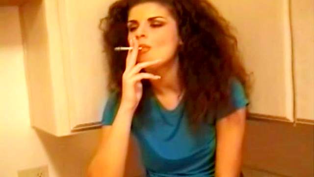 Sexy brunette smoking and undressing