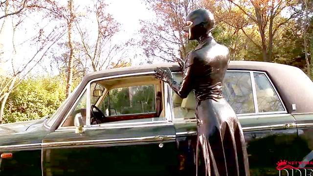 Latex Lucy posing in front vintage Rolls-Royce