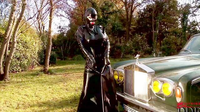 Latex Lucy posing in front vintage Rolls-Royce