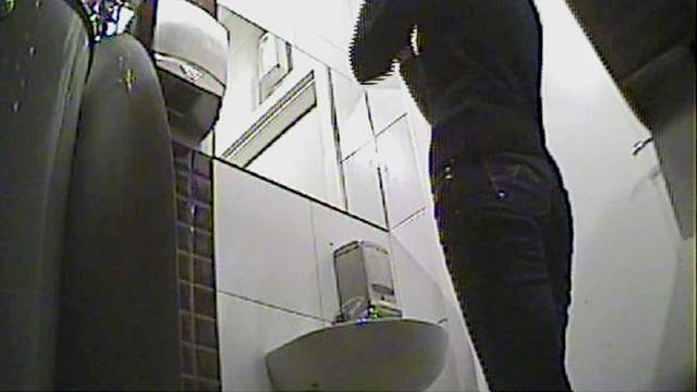 Curly blonde with skinny body is pissing in the toilet